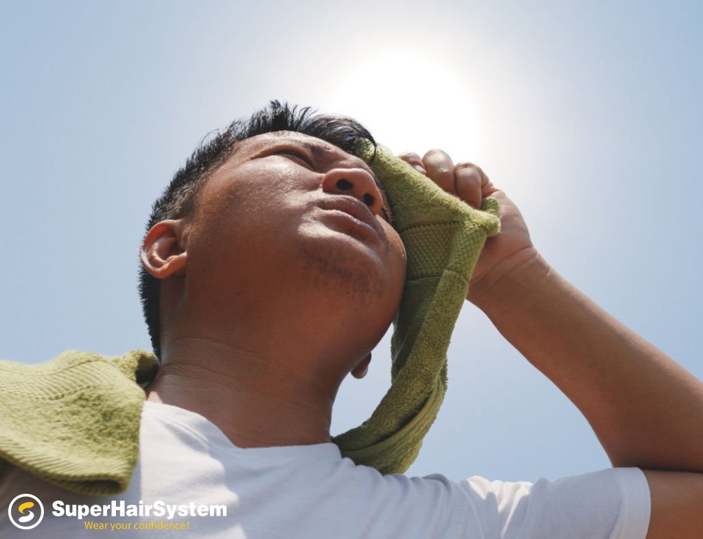 Man wiping sweat